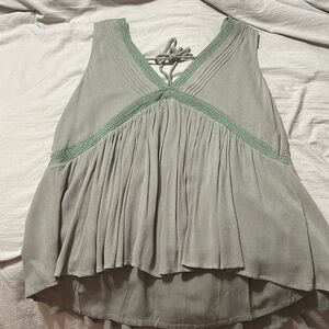 Boutique top. Never been worn. Tie back and flowy. Large